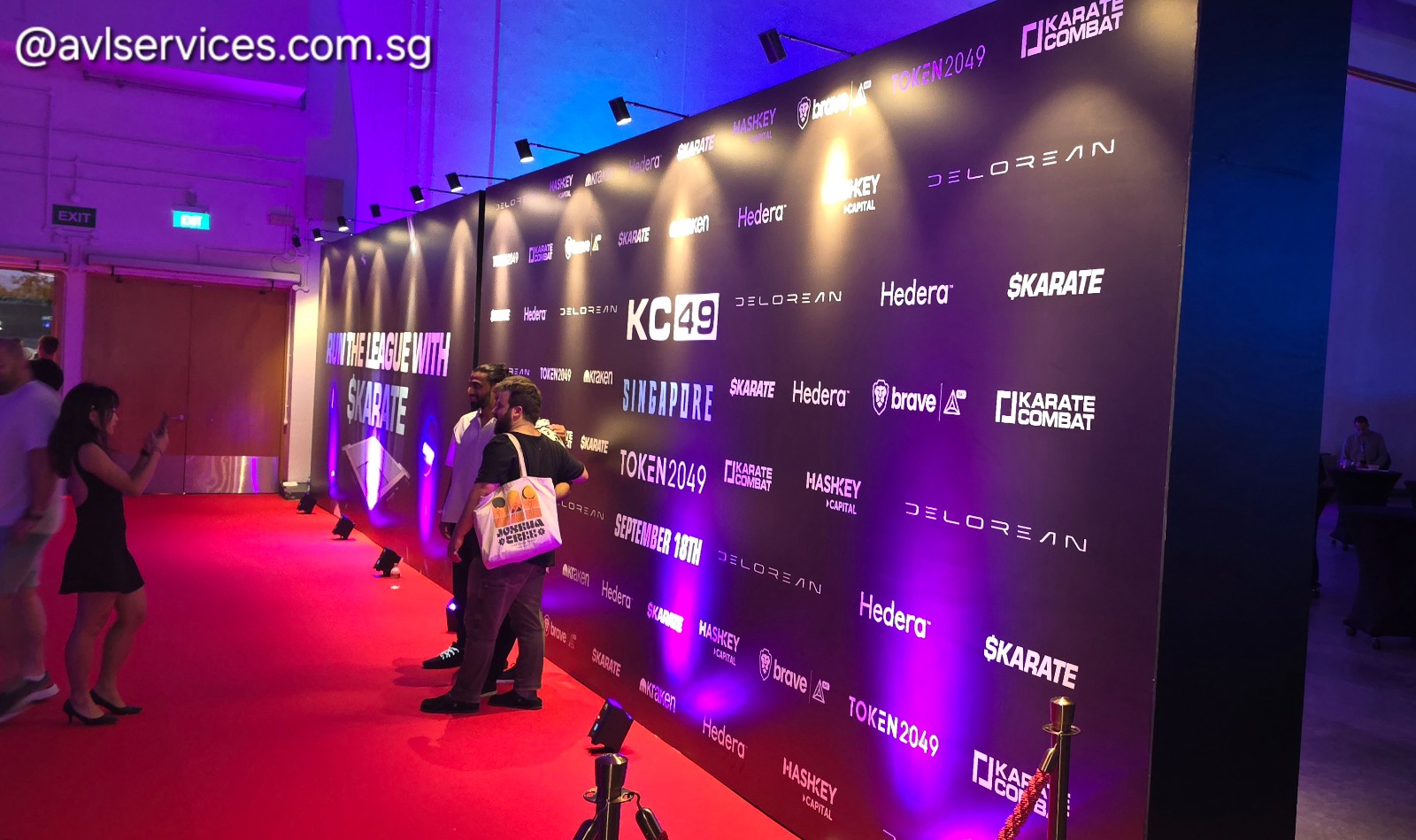 Token2049 Singapore exhibition step-and-repeat wall with branded LED and photo-call lighting