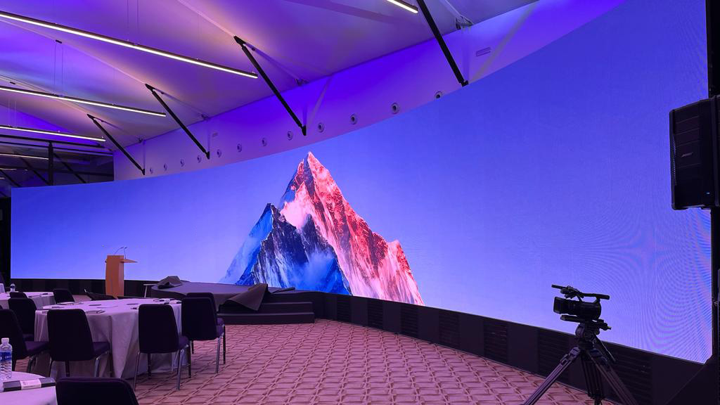 Curved LED video wall installation with vibrant content display